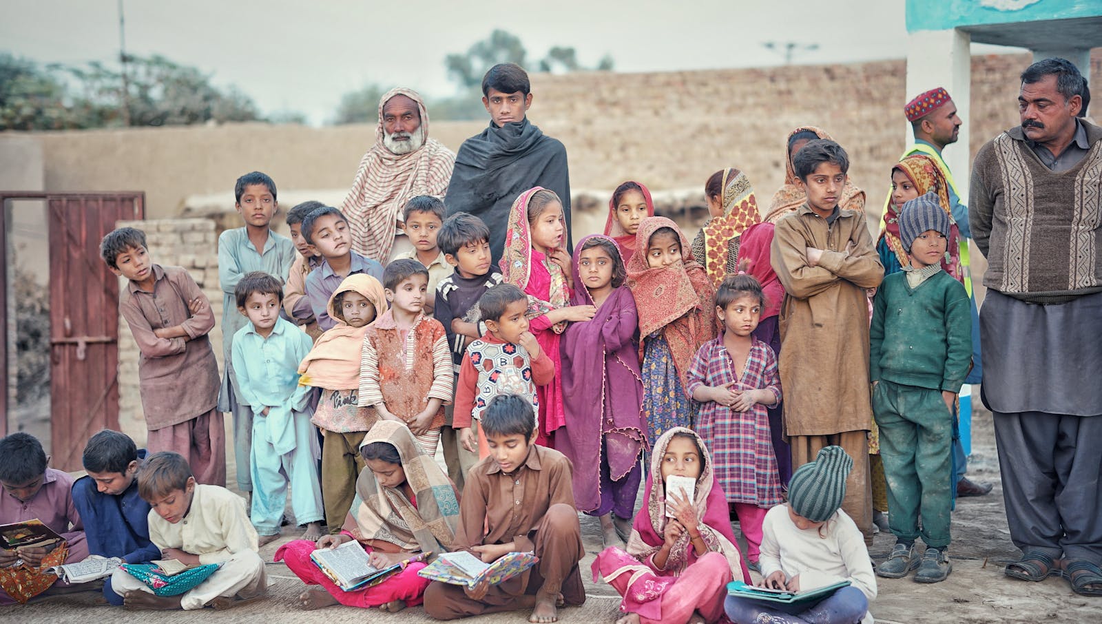 A community of children gathered with their books
